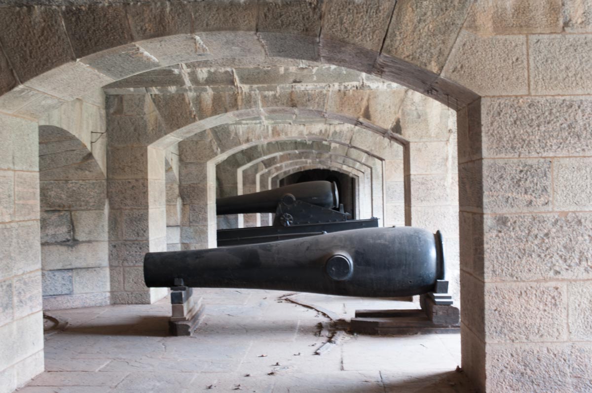 Staten Island Bridge Cannons, framed by arches.